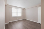 Spacious apartment interior showcasing a bright room with modern flooring and window in New Orleans luxury apartments