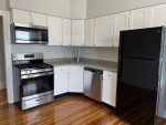 Modern kitchen with stainless steel appliances and granite countertops in a 2Bed 1Bath apartment in Lynn.