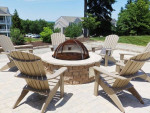 Cozy outdoor fire pit area with comfortable chairs in an apartment community in Midlothian, VA.