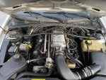 Engine view of a 2004 Supercharged GTO showcasing the LS1 engine and Magna supercharger.