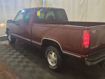 GMC Sierra 1500 SLT Extended Cab truck in maroon color with low mileage and polished rims