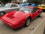 1989 Ferrari 328 GTB in red with tan interior, showcasing its flawless condition and low mileage of 9,300.