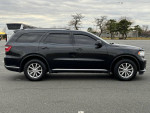 2016 Dodge Durango SXT RWD parked, showcasing sleek design and clean exterior with 116,000 miles.