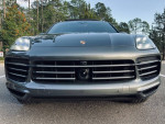 Front view of a 2019 Porsche Cayenne S AWD in Mahogany Metallic color with sleek design.