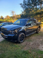 2007 Chevrolet Avalanche for trade or sale, features blacked-out exterior and 5.3L engine, 248k miles.