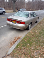 2001 Buick Century parked on the street, showing side view and low mileage, ready for a test drive.