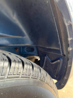 Close-up of tire on a 2004 Chevrolet Astro cargo van showcasing tread and wheel well.