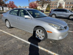2005 Lexus ES 330 with low mileage, clean title, parked in a lot, showcasing its silver exterior.