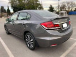 Gray Honda Civic with clean title, 114k miles, automatic, and features like reverse camera and parking sensors.