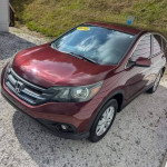 2013 Honda CR-V EX in maroon, featuring a sunroof and backup camera, parked on gravel.