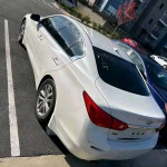 White INFINITI Q50 parked with clean title, automatic transmission, and 60,000 miles on the odometer.