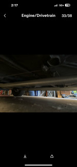 Underneath view of a modified 1963 Nova SS showcasing the exhaust and chassis setup.