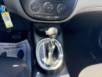 Interior view of 2015 Kia Soul with gear shifter and climate controls