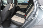 Interior view of 2018 Honda Civic EX showing spacious back seats in black and ivory design.