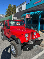 1976 red Jeep CJ7 for sale, excellent condition with a 4-inch lift and manual transmission.