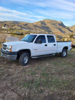 2003 Chevrolet Silverado 2500HD Crew Cab 4WD in white, for sale with 221,000 miles, well-maintained and ready for towing.