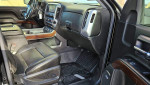Interior view of a well-maintained 2018 GMC Sierra 1500 SLT with leather seats and modern dashboard features