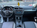 Interior view of a 2018 Volkswagen Tiguan S with touchscreen, steering wheel, and modern dashboard features.
