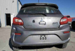 Rear view of a 2018 Mitsubishi Mirage SE in silver, showcasing its compact hatchback design and sporty aesthetics.