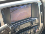 Rearview camera display in a 2014 GMC Sierra 1500 SLE showing parking guidelines.