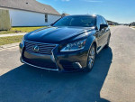 2013 Lexus LS 460 L in excellent condition parked on the street, showcasing its sleek design and luxury features.