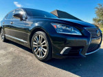 2013 Lexus LS 460 L in black, showcasing sleek design and premium wheels, perfect for finance and trade options.