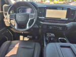 Interior view of a 2022 Chevrolet Silverado 1500 Limited with black seats and modern dashboard features.
