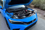 2024 Honda Civic Sport hatchback engine view showcasing its modern design and features