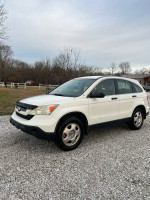 2009 Honda CRV for sale, clean condition with new tires and no dents, 230,000 miles, priced at $5,000.
