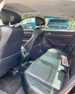 Interior view of a 2018 Honda Accord Sport with clean black leather seats and ample space.