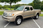 2004 Toyota Tundra regular cab 4WD pickup truck in a park with a durable design and reliable performance.