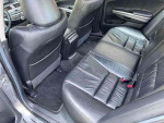 Interior of 2008 Honda Accord EX-L showcasing black leather seats and spacious back row.