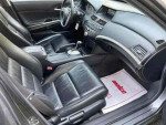Interior of a 2008 Honda Accord EX-L showcasing leather seats and modern dashboard features.