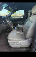 Interior view of a 2019 Chevrolet Silverado 1500 with leather seats and modern features.