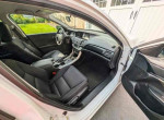 Interior view of a 2013 Honda Accord Sport with black seats and dashboard, showcasing excellent condition and space.