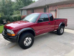 2003 Chevrolet S-10 LS ZR2 in red, extended cab, 7,400 miles, clean title, excellent condition, available for $2,500.