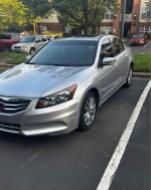 2012 Honda Accord EX-L V-6 in silver with 150,000 miles parked in a lot