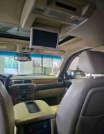 Interior view of a 2007 Chevrolet Tahoe LT showing dashboard, leather seats, and overhead DVD player.