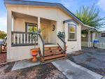 Step inside this beautifully maintained 3-bedroom, 2-bath residence in an all-age mobile home park.