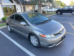 2008 Honda Civic LX coupe in gray, parked with clean body, well maintained exterior, no visible damage.