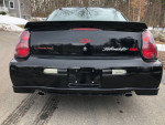 Rear view of a 2004 Chevrolet Monte Carlo SS Intimidator edition, showcasing its sleek design and dual exhaust.