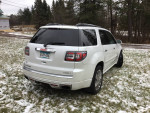 2016 GMC Acadia Denali FWD in white, well maintained with various features, parked in snowy landscape.