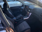 Interior of a 2007 Subaru Outback with seating and dashboard features