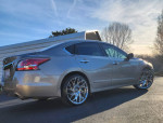 2015 Nissan Altima 2.5 SL in good condition with chrome wheels parked outdoors
