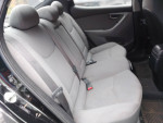 Interior view of a 2015 Hyundai Elantra SE showing spacious backseat with grey upholstery.