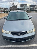 Front view of a well-maintained 2001 Honda Odyssey EX minivan with 53,000 miles in gray color.