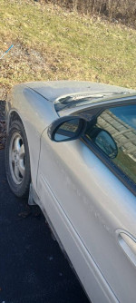 Side view of a 2008 Ford Taurus SEL FWD showing exterior condition and new tires.