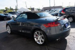 2009 Audi TT 3.2L Roadster in Aruba Blue Pearl with black convertible roof, showcasing luxury and performance.