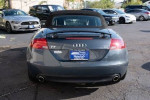 Rear view of a 2009 Audi TT 3.2L Roadster in Aruba Blue with a black convertible roof.