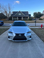 Front view of a 2017 Lexus IS200t parked in excellent condition with 92,000 miles in a residential area.